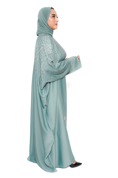 Abaya verte avec éclat diamanté et tissu de qualité supérieure - vue de profil